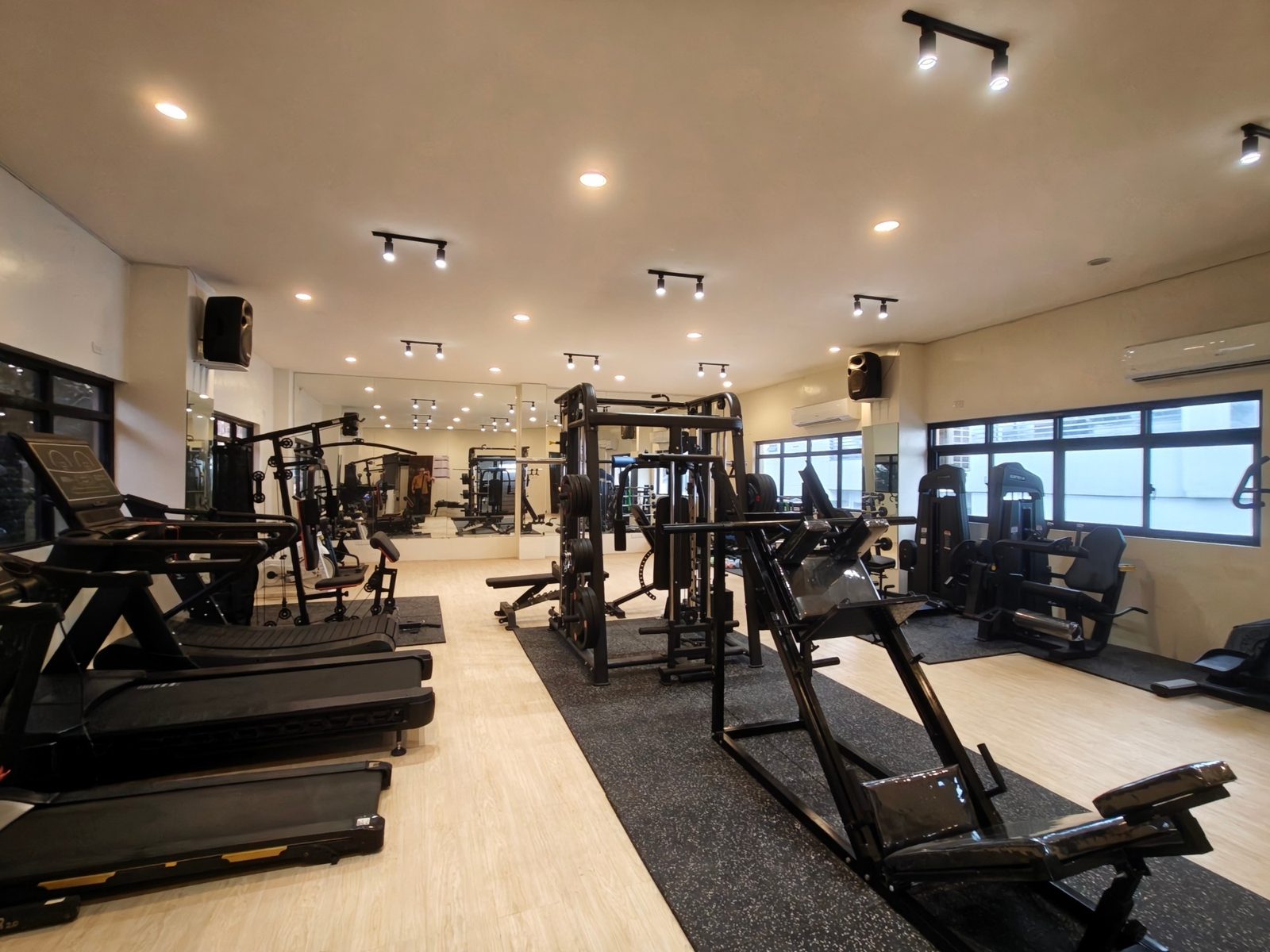 Leg press, cable machines and treadmills on rubber flooring